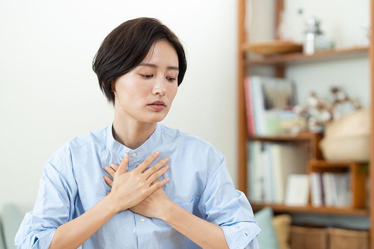 体調不良な女性