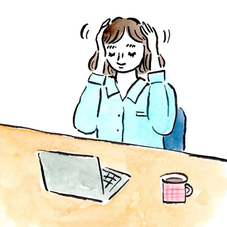 側頭部をマッサージする女性